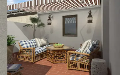 Ideas para decorar un patio sencillo: muebles de ratán, cojines a cuadros y plantas crean un espacio acogedor.