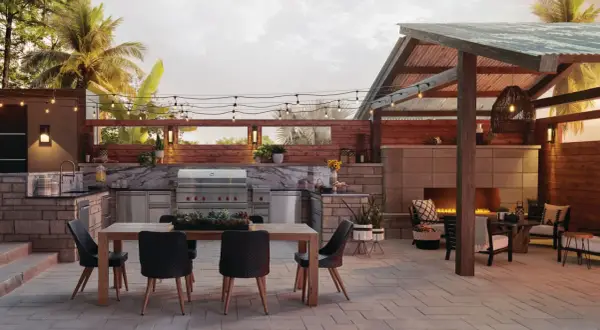 Elegantes patios con barbacoa, cocina exterior, chimenea y zona de comedor bajo luces cálidas.
