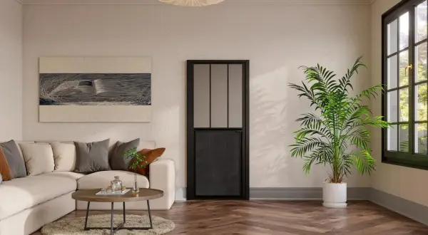 Un salón moderno con sofá beige, mesa de centro y una puerta negra de cristal, mostrando diferentes tipos de puertas.