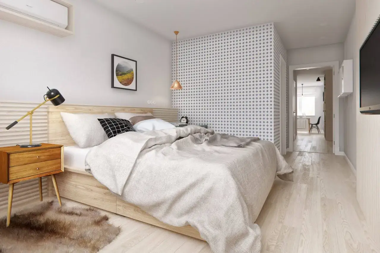 Habitaci&oacute;n acogedora con cama doble, mesita de noche de madera y alfombra mullida. Los metros cuadrados de esta habitaci&oacute;n normal se aprovechan al m&aacute;ximo con un dise&ntilde;o moderno.