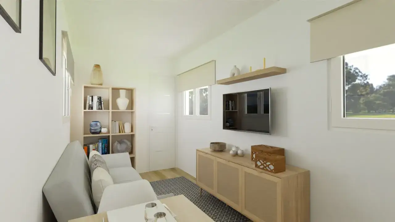 Salón moderno con sofá gris, estantería y mueble de TV. Estimación del precio construir casa 30 m2.