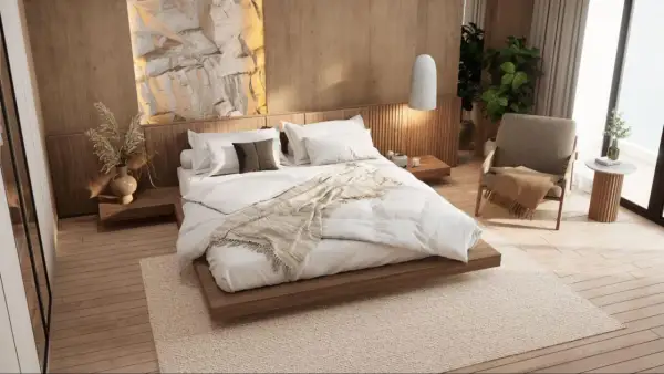 Ideas para diseñar habitacion: cama baja de madera, pared de roca iluminada, silla acogedora y plantas.