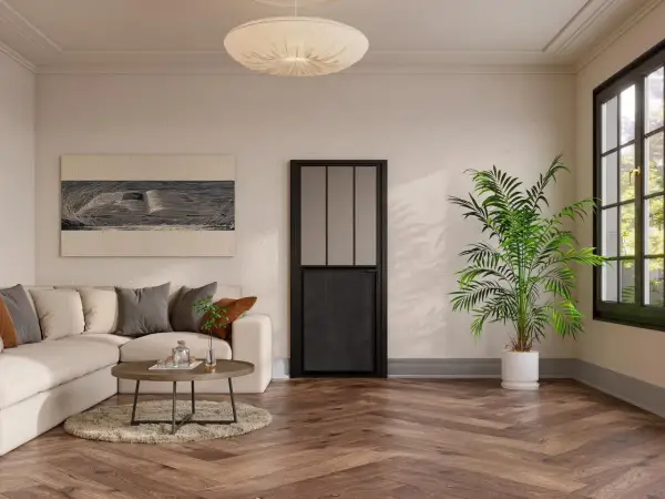 Un salón moderno con sofá beige, mesa de centro y una puerta negra de cristal, mostrando diferentes tipos de puertas.